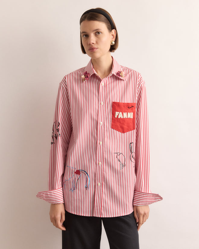 Woman wearing a Calder Painted Cirque Long Sleeve Shirt, featuring red and white stripes and