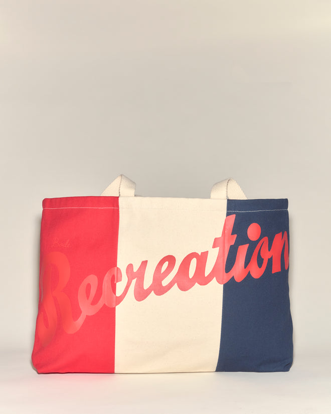 The Recreation Tote is a cotton bag with red, white, and blue vertical stripes and