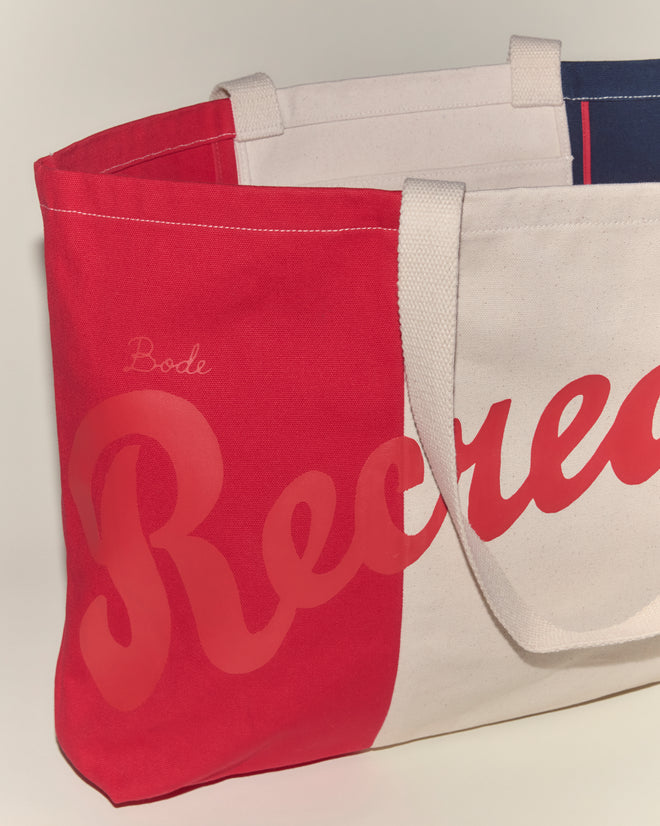 The Recreation Tote is a cotton bag with red and white panels, featuring