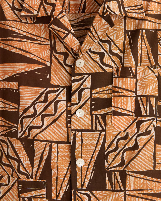 Close-up of the Cocoa Bean Shirt - S/M, made from vintage barkcloth with a brown and tan geometric pattern, textured weave, and white buttons.