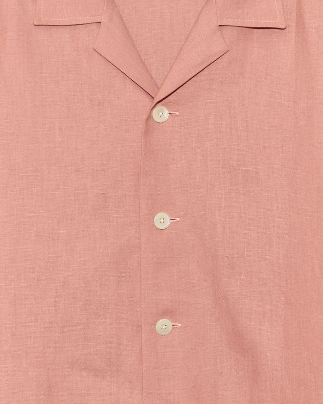 Close-up of the Conch Shell Shirt - L, featuring light pink deadstock linen, a collar, and three visible white buttons.