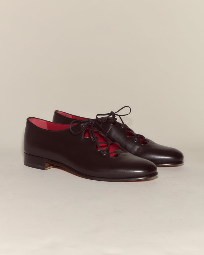The County Clare Shoes - Black are black Napa leather lace-ups with low heels, red inner lining, and the classic Bode County Clare design, shown on a plain background.