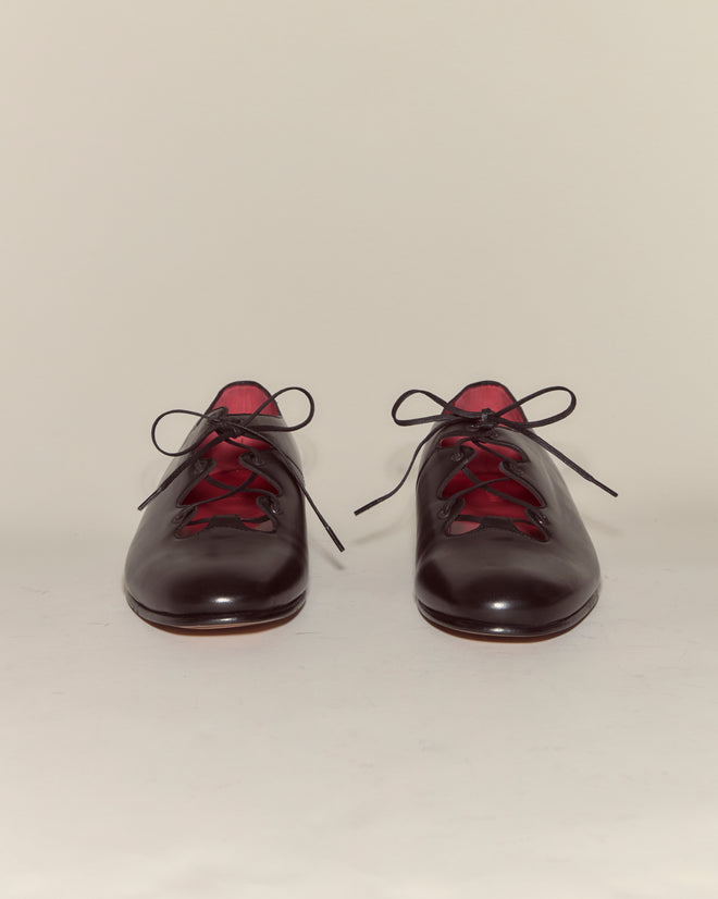 County Clare Shoes - Black: Sleek black Napa leather lace-ups with red inner lining, made in Italy, shown on a plain white background.