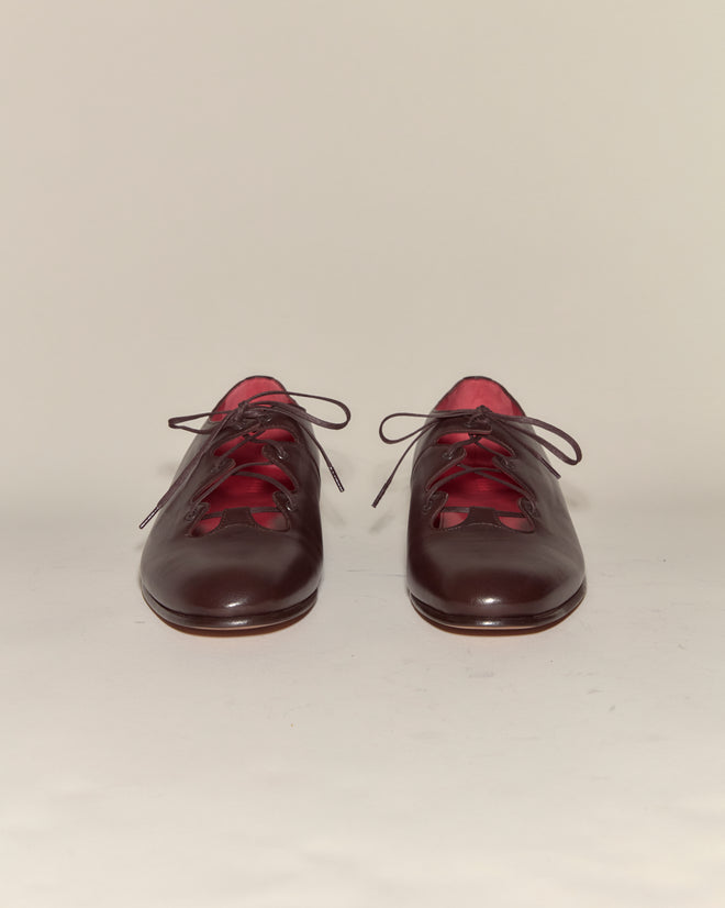 County Clare Shoes - Brown: Dark brown Italian leather lace-up shoes with pink interiors, shown facing forward on a plain light background.