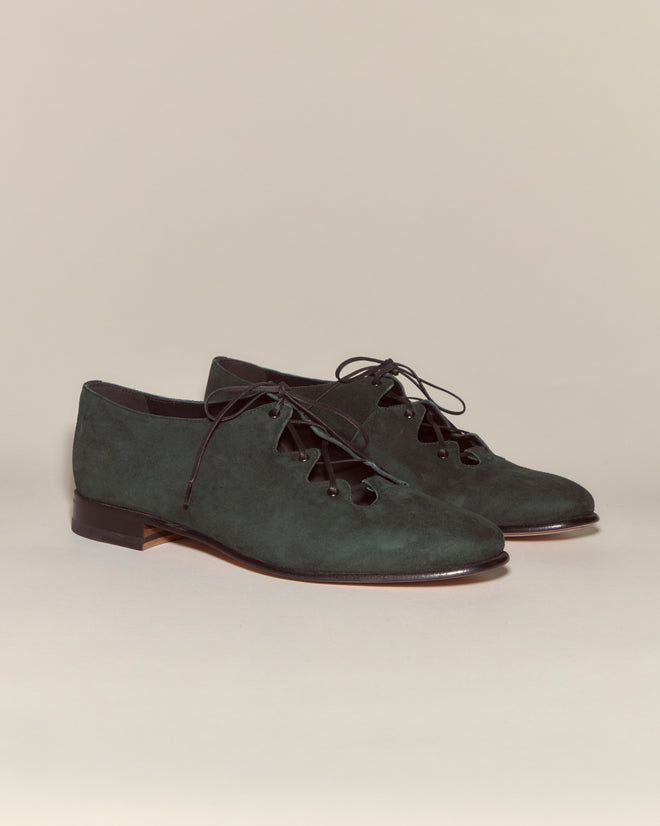 A pair of Suede County Clare Shoes - Green with low heels and a lace-up design, made in Italy, displayed on a neutral background.