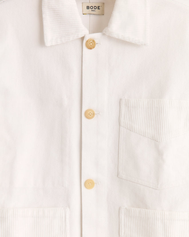 The Craft Jacket - White features heavyweight cotton twill, tan buttons, patch pockets, corduroy trim, and a visible
