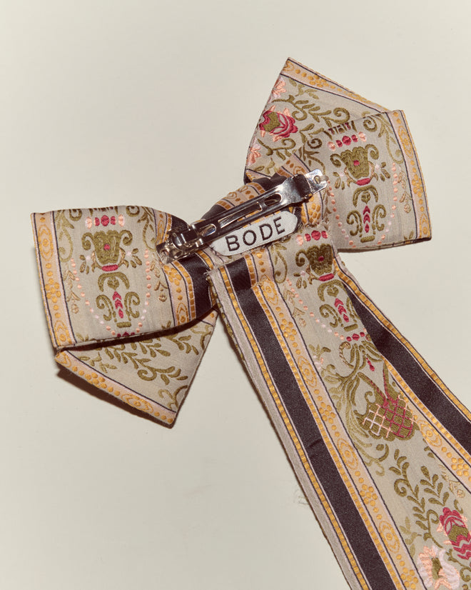 The Floret Brocade Bow Barrette is a handmade floral brocade bow featuring a metal