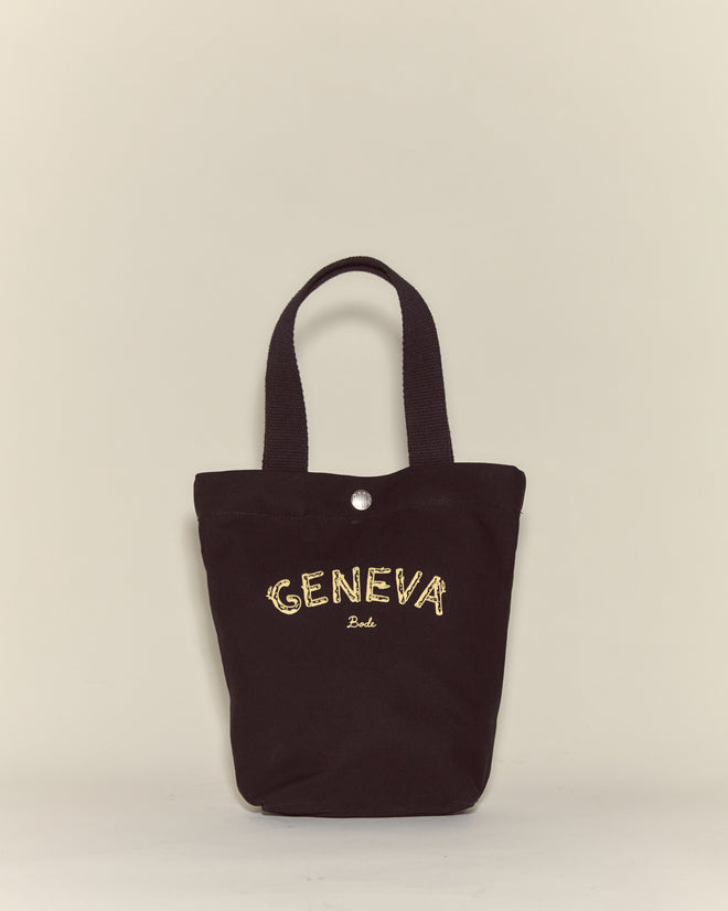 The Small Geneva Tote is a black canvas bag featuring