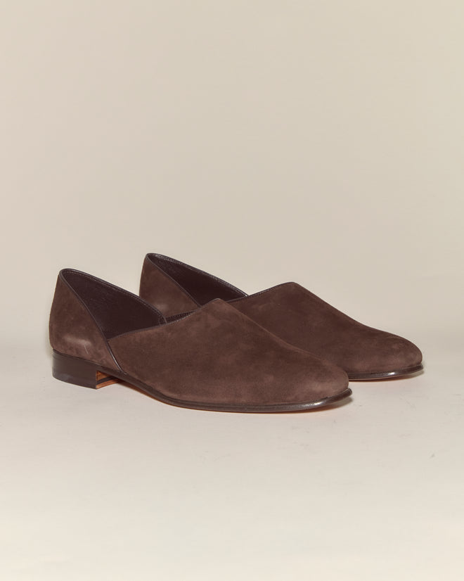 The Suede House Shoes - Brown are Italian suede slip-ons with low heels and a leather sole, displayed against a neutral background.