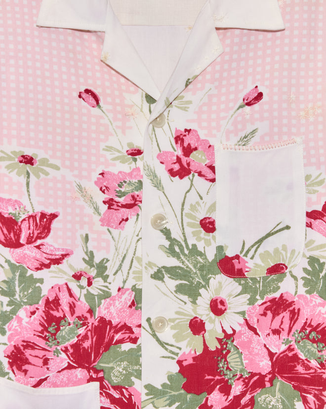 Close-up of the Lovely Garden Short Sleeve Shirt - XS/S in pink, featuring white buttons and a chest pocket, crafted in a vintage tablecloth style for a unique midcentury-inspired look.