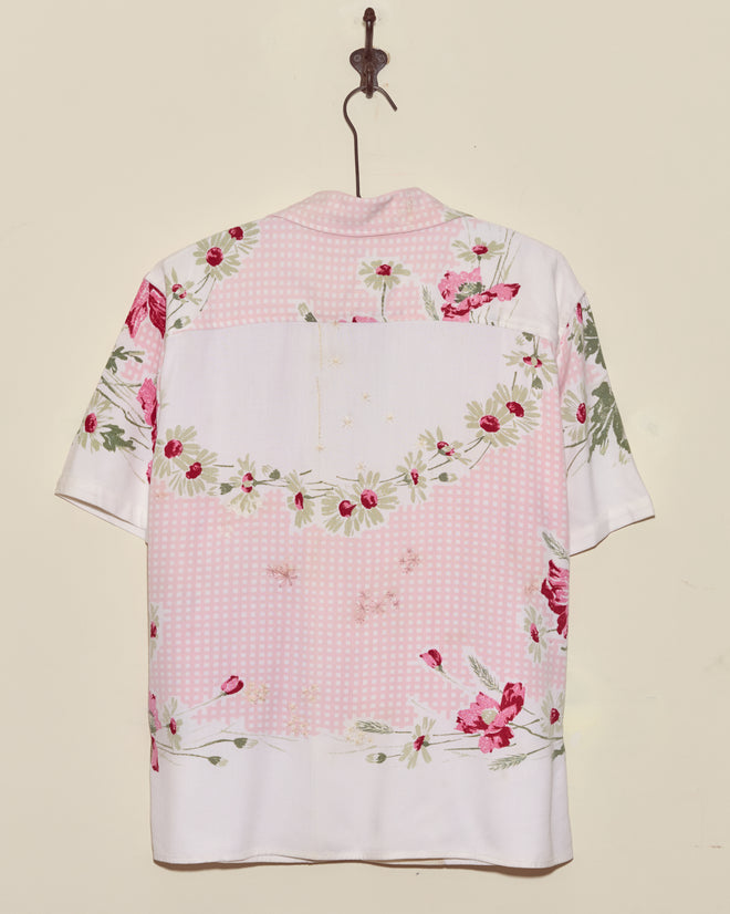Lovely Garden Short Sleeve Shirt - XS/S features pink and white checks with red floral patterns, displayed on a wall hook.