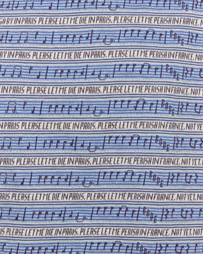 The Lyric Tee features blue fabric with Paris jacquard stripes, musical notes, and the repeated text: