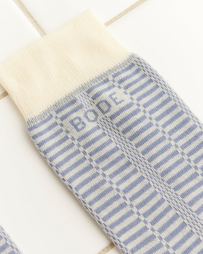 Close-up of the Micro Check Socks - Blue/Cream, featuring blue and cream stripes reminiscent of vintage children's socks, with