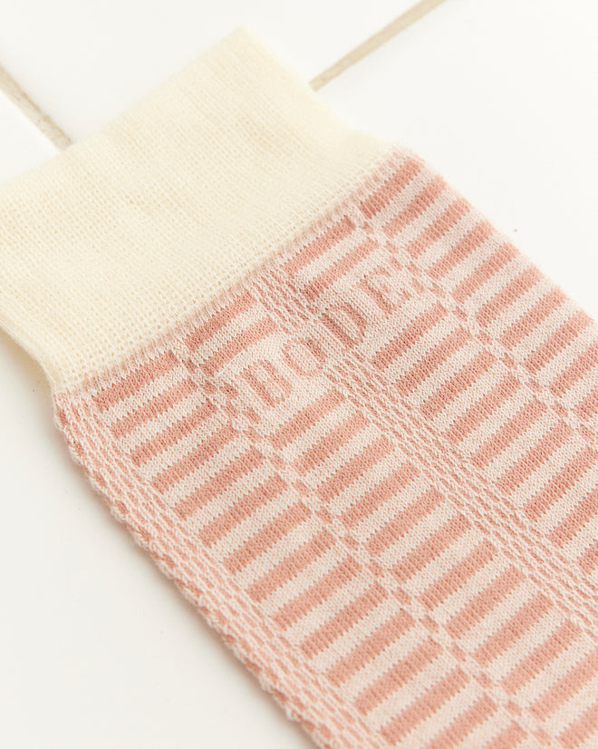 The Micro Check Socks in Pink/Cream feature a 1960s-inspired check pattern with