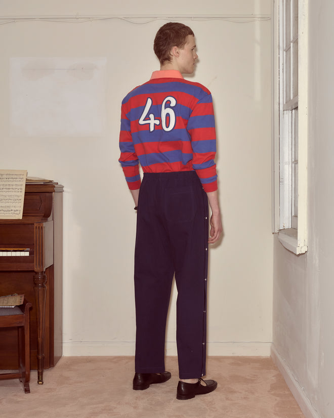 Wearing a red and blue striped shirt with
