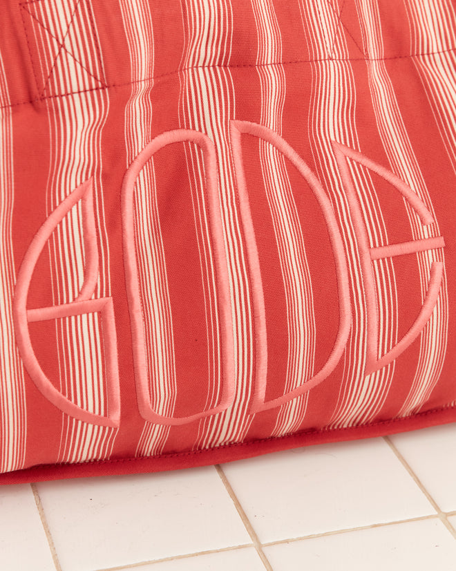 The Parasol Stripe Tote features red quilted fabric with thin awning stripes and