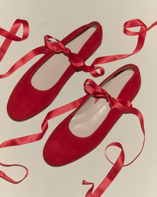 Musette Flats - Chili, featuring matching satin ribbons, are displayed on a light background.