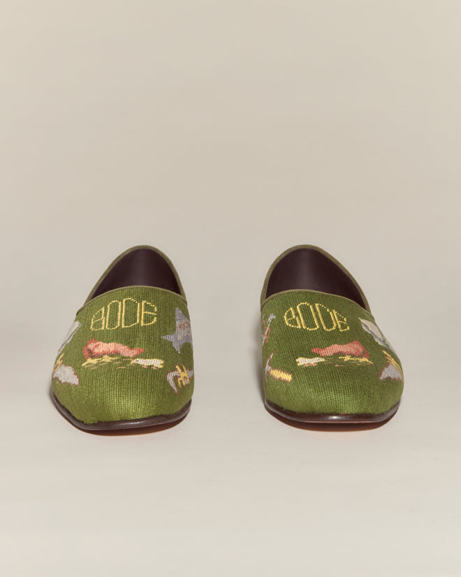 A pair of Needlepoint House Shoes in green with animal motifs and