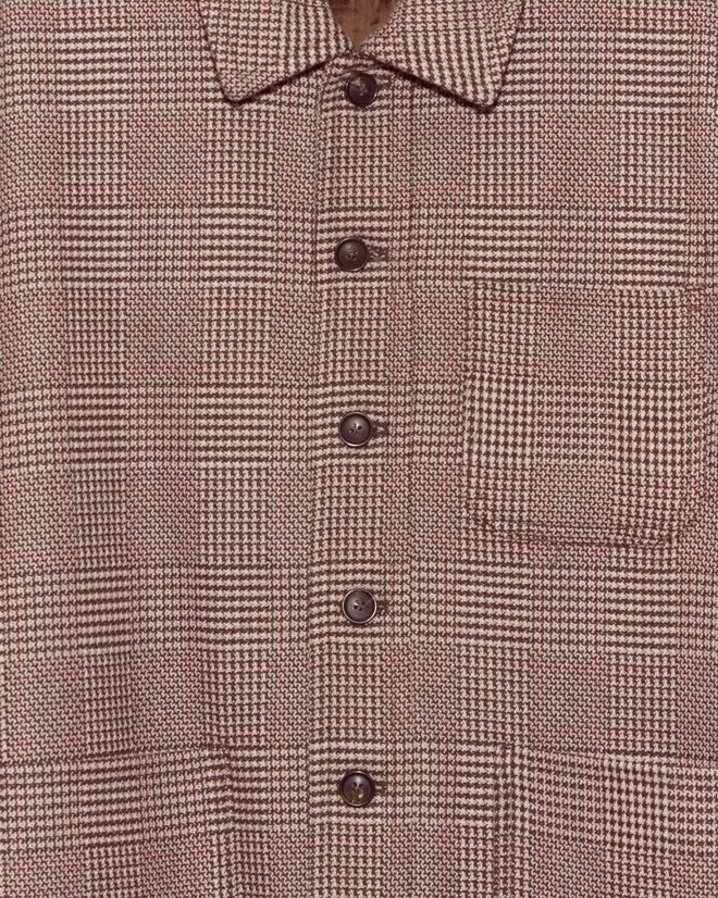 Close-up of the unique Pink Granite Jacket in size L/XL, featuring a brown and beige plaid pattern, chest pocket, and dark buttons.