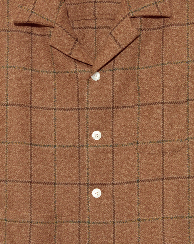 The Pinscher Check Overshirt - M/L features a brown plaid design with white buttons, a single chest pocket, and a subtle green check pattern—perfect for layering and offering timeless style.