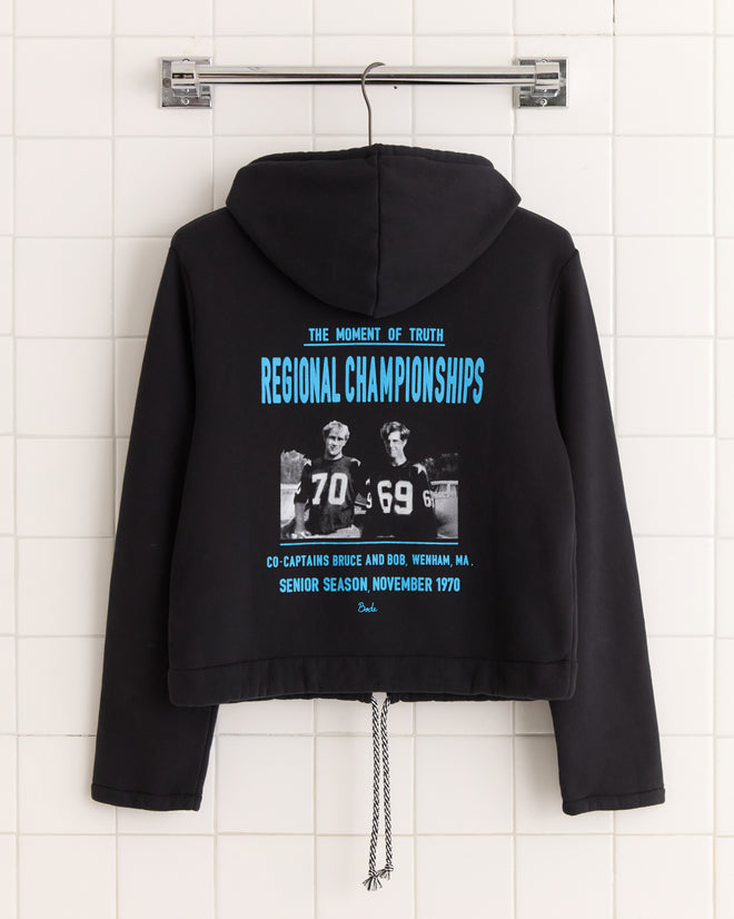 Regionals Hoodie - Black shown on hanger with vintage football graphic and blue regional championships text on back.