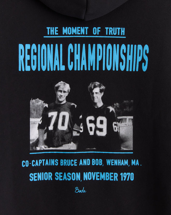 Two football players in jerseys 70 and 69 pose for a black and white team photo with championship text above, both wearing the Regionals Hoodie - Black for a timeless athletic look.