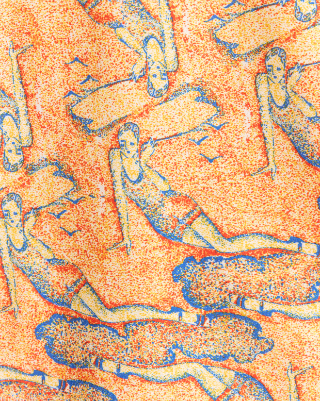 The Sandbank Long Sleeve Tee features a Pointillist illustration of figures in swimwear reclining on an orange speckled backdrop, capturing the charm of a 1960s-1970s vintage tee.
