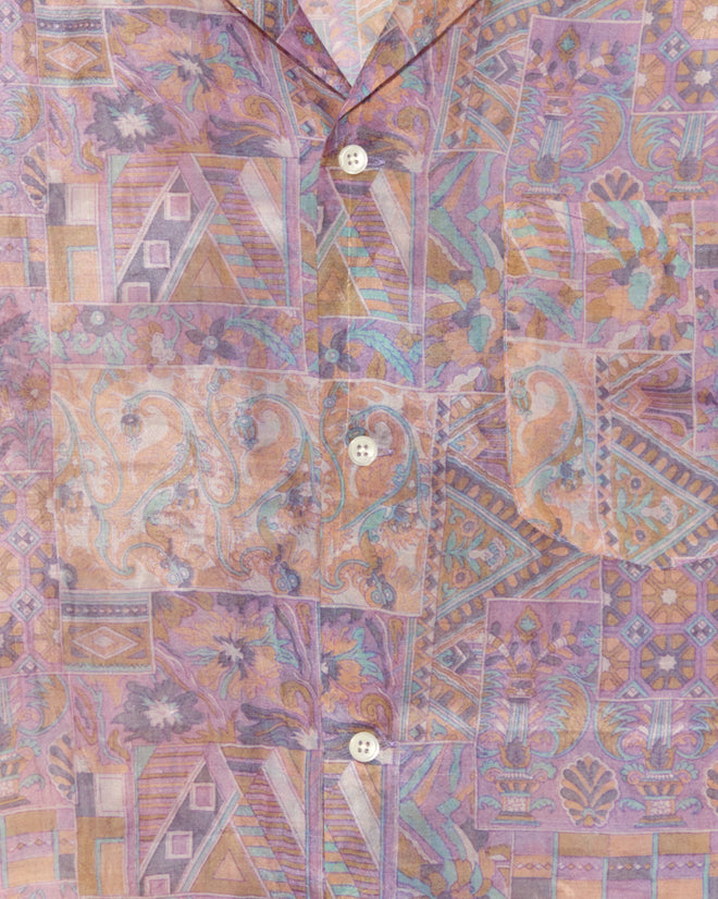 Close-up of the Sheer Puzzle Shirt (M/L), a vintage piece with pastel geometric and floral designs in purple, pink, and tan.