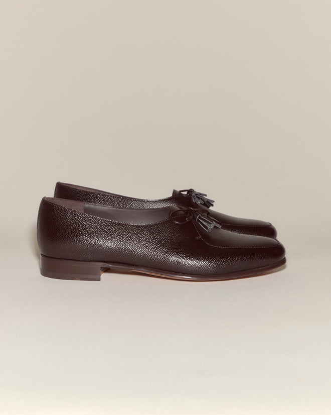 The Tassel Shoes - Brown are vintage loafers made from rich brown pebbled leather with tassels, shown side by side on a neutral background.