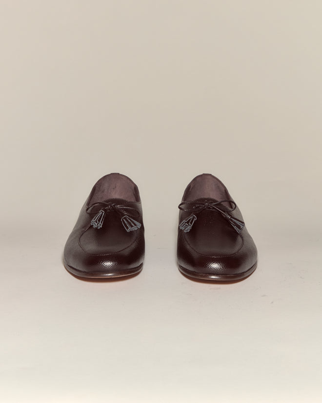 Pair of brown Tassel Shoes displayed side by side on a plain light background.