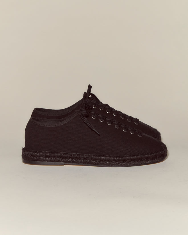 A pair of Tennis Espadrilles - Black, featuring vintage cloth material, laces, and flat soles, displayed against a plain background.