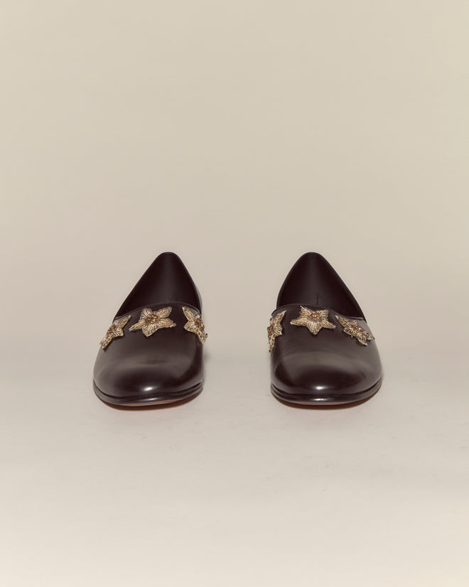 Bullion Star Shoes: black Napa leather loafers featuring sequined stars and gold star embellishments, displayed on a plain light background.