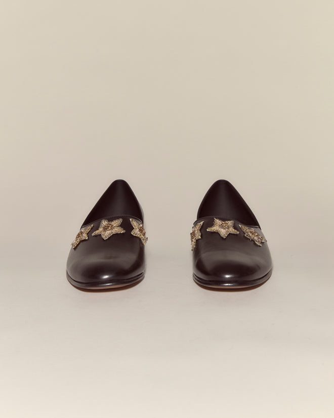 Bullion Star Shoes crafted from black Napa leather feature decorative sequined stars on the front, shown against a plain background.