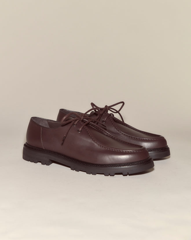 University Shoes - Brown: Elegant Italian calf leather lace-up shoes in dark brown with thick black soles, displayed on a light beige background.