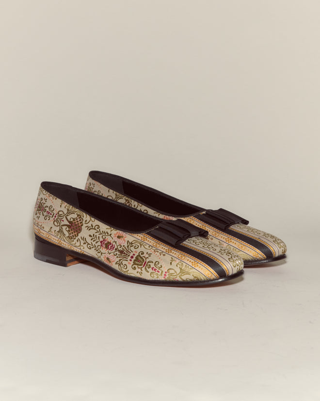 Floret Brocade Opera Pumps: Men's evening slippers featuring a floral brocade pattern, striped accents, and black tassels, inspired by classic Opera pumps, displayed on a plain background.