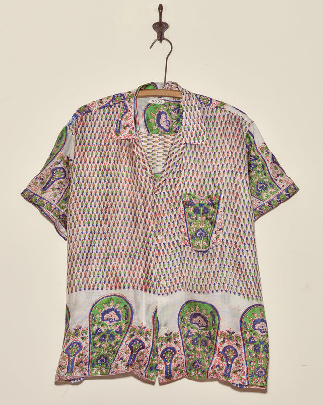 The Verdigris Print Shirt - XXL is a short-sleeve button-up crafted from vintage sari fabric with colorful paisley and geometric prints, making it a one-of-a-kind piece that adds unique charm to any wardrobe.