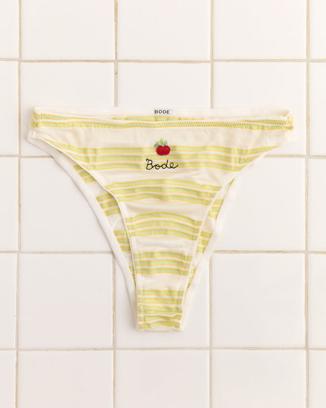 Apple Briefs: Women's high-cut briefs in yellow and white stripes, featuring "Bode" and a strawberry embroidery on the front, shown on white tiles.