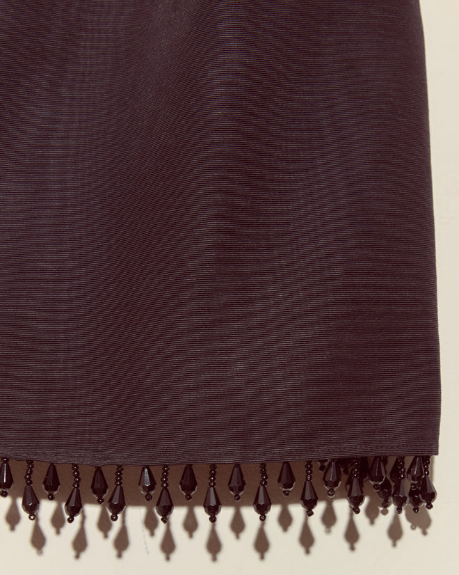 The Anglia Jet Tank - S features dark fabric with a subtle ribbed texture and black droplet bead trim along the bottom edge, echoing the look of a vintage New York faille tank.