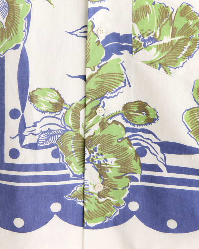 Close-up of a Blueberry Polka Dot Shirt (size S/M) showcasing its unique green and blue geometric floral pattern with white buttons.