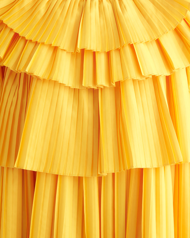 Close-up of the Brunch Dress - Yellow, showcasing cascading tiers and pleated layers, crafted from recycled polyester.