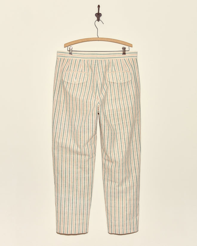Chart Stripe Trousers - 36, featuring pastel vertical stripes on vintage Chinese fabric, displayed from the back on a wooden hanger against a plain wall.