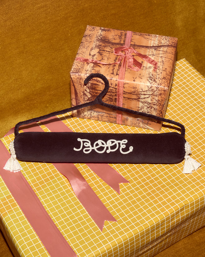 A padded Cloakroom Hanger - Black with 