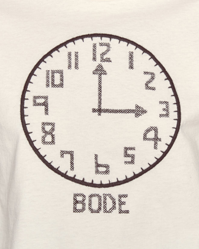 The Clock Long Sleeve Tee features an embroidered clock pointing to 12:00 and 3:00 above "BODE" on a white background, inspired by vintage-weight cotton ticking styles.