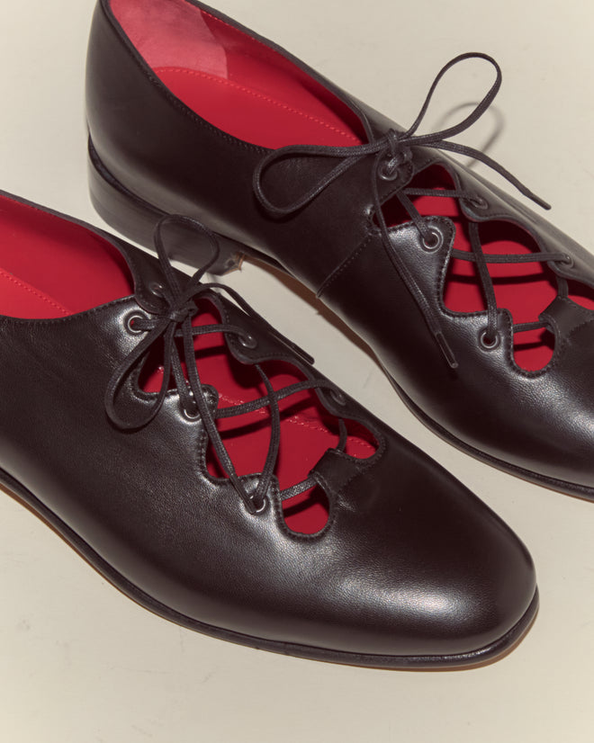 The County Clare Shoes - Black feature black Napa leather, lace-up cut-outs, bright red insoles, and are made in Italy.