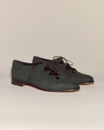 A pair of Suede County Clare Shoes - Green with low heels and a lace-up design, made in Italy, displayed on a neutral background.