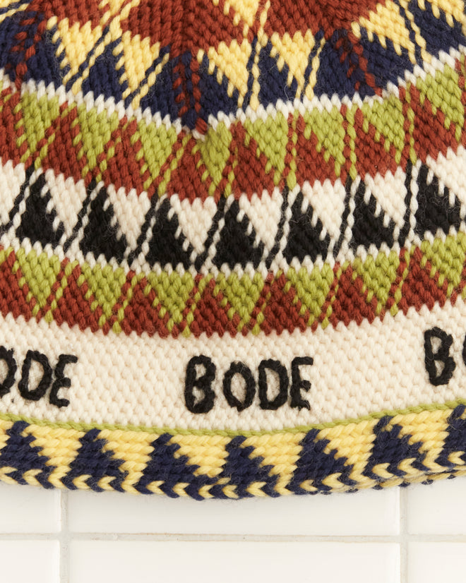 The Delta Jacquard Hat exudes a 1970s-inspired vibe with its colorful geometric patterns and 