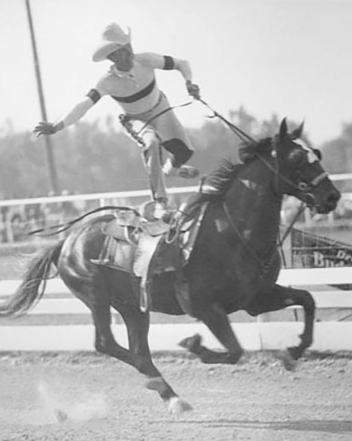 Historical photograph of an unidentified rodeo trick-rider in the 1930s.