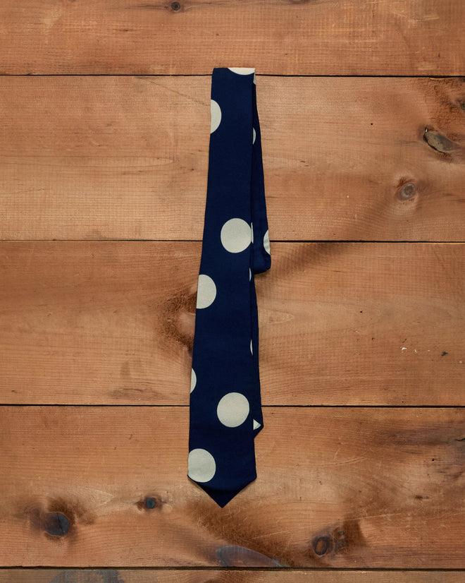 Dot Crêpe Neck Tie in navy blue crêpe with large cream-colored polka dots.