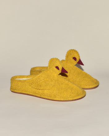 Duck Slipper - Yellow Red: Cozy yellow slippers shaped like ducks, featuring wings, eyes, and red beaks for a playful twist on classic felt house shoes, displayed against a plain background.