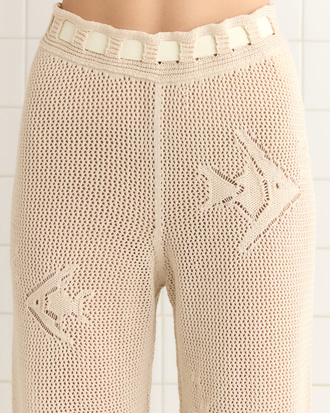 Angel Fish Joggers in cream, featuring crocheted abstract patterns and square embellishments on the waistband, made from 100% cotton.